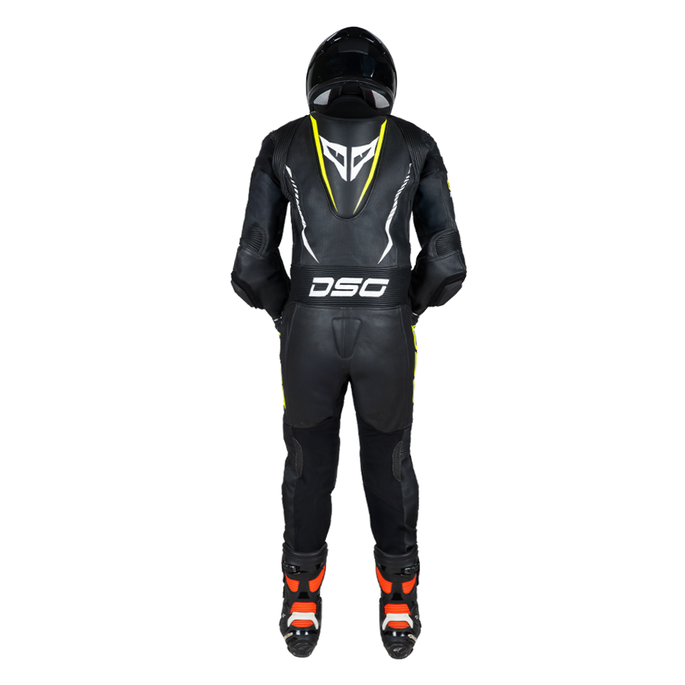 Rear view of a rider wearing the DSG GP Racing Leather Suit in black and yellow fluo